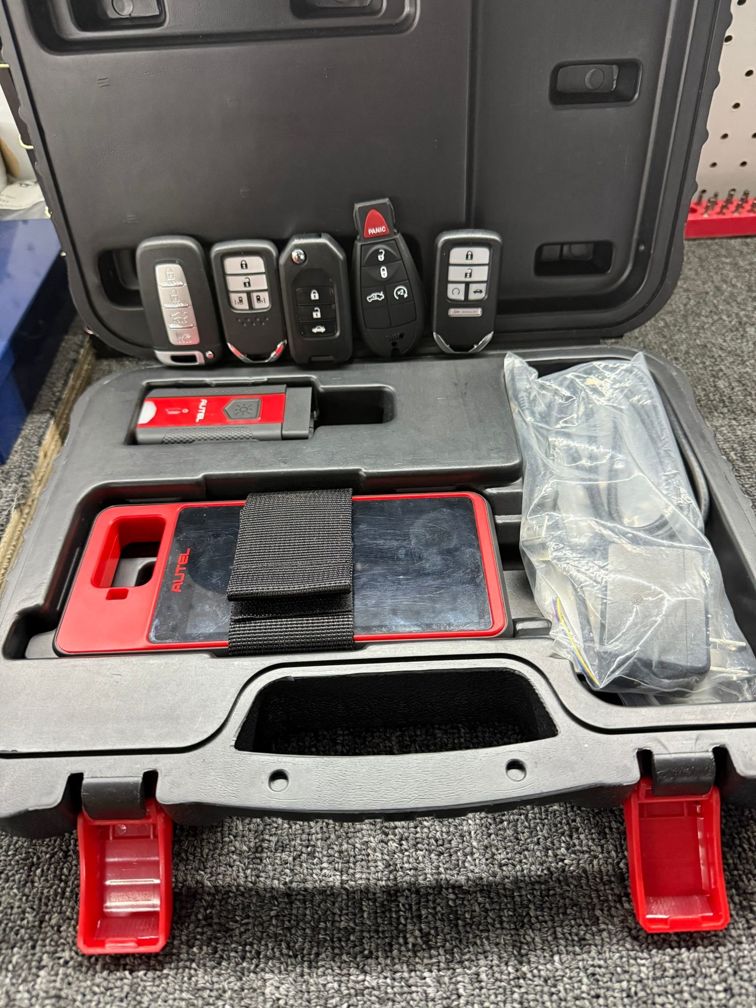 Key fobs and programming tools in a locksmith case